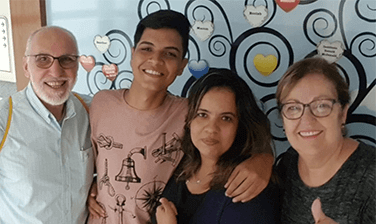 An Ronald McDonald House family, the de Araujo Moeiras, Juan Carlos at 18 years old in left-center, surrounded by three family members